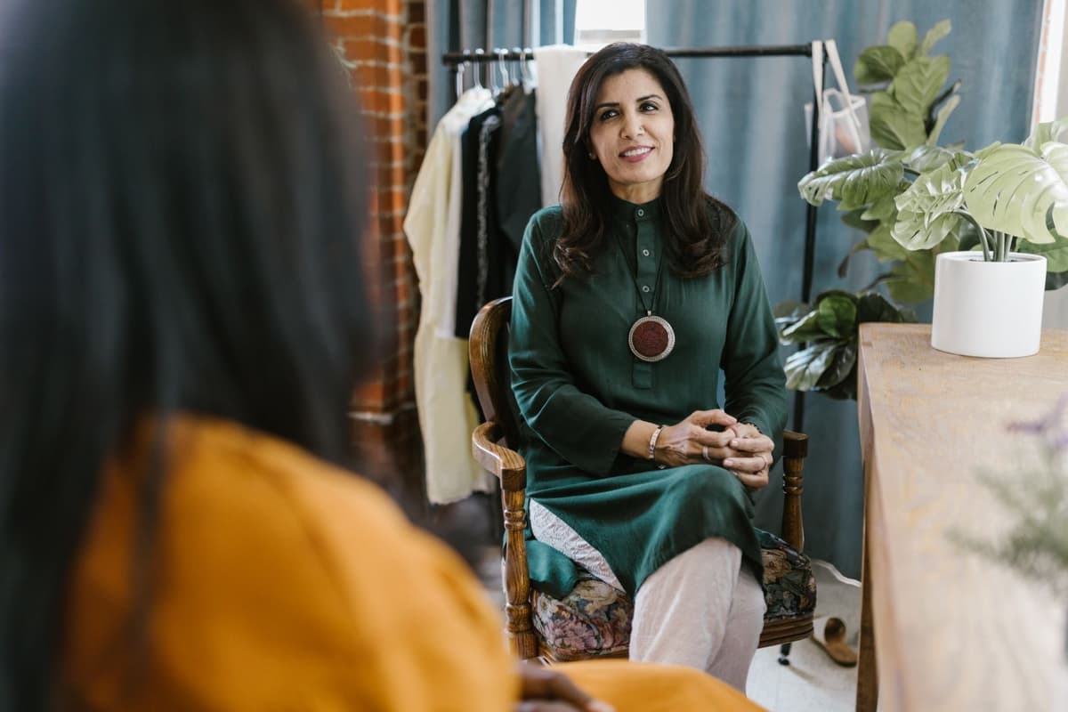 A counsellor listening warmly to a client